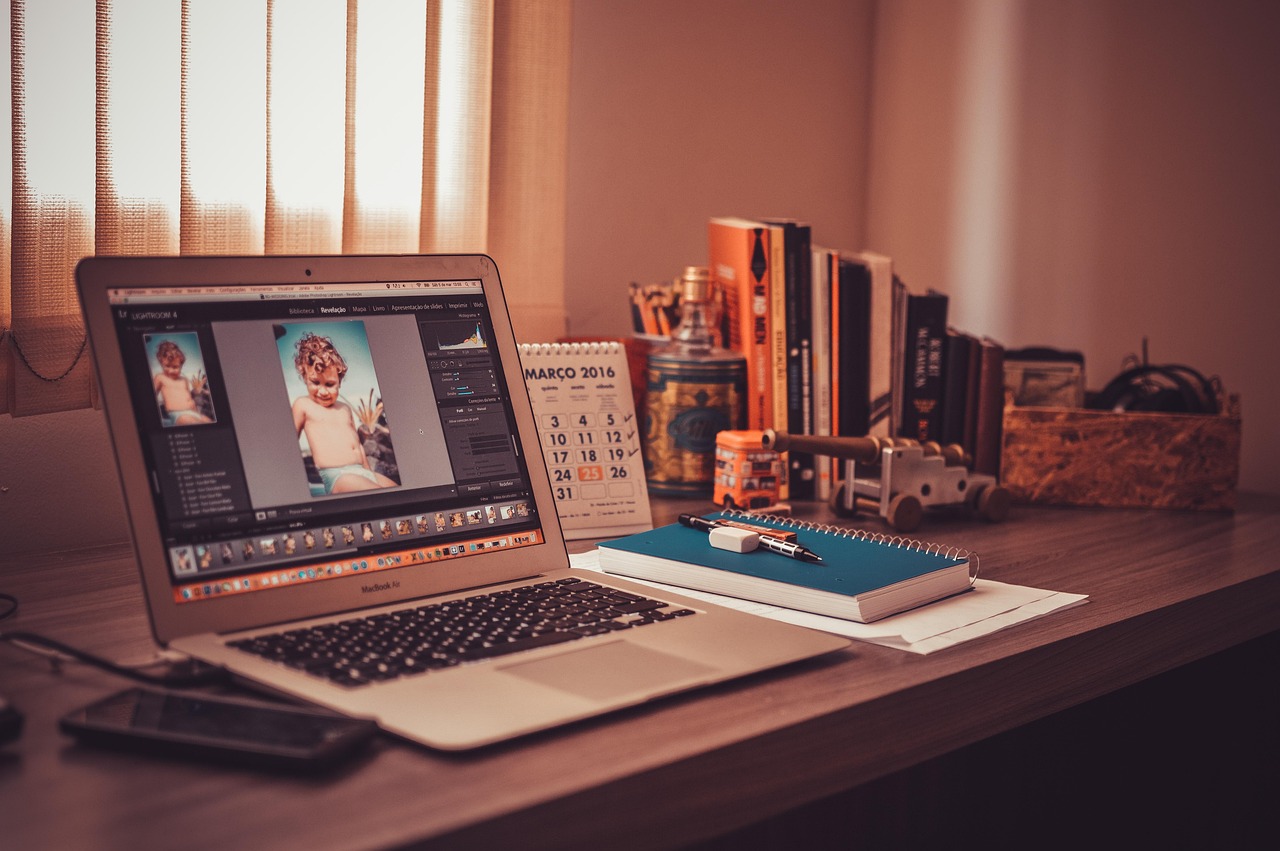Desk, laptop, office — Health Benefits of Air Conditioning